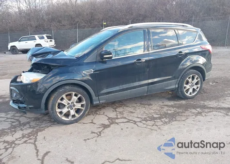 2016 Ford Escape Titanium z USA, uszkodzony, nr VIN 1FMCU0J91GUB36876
